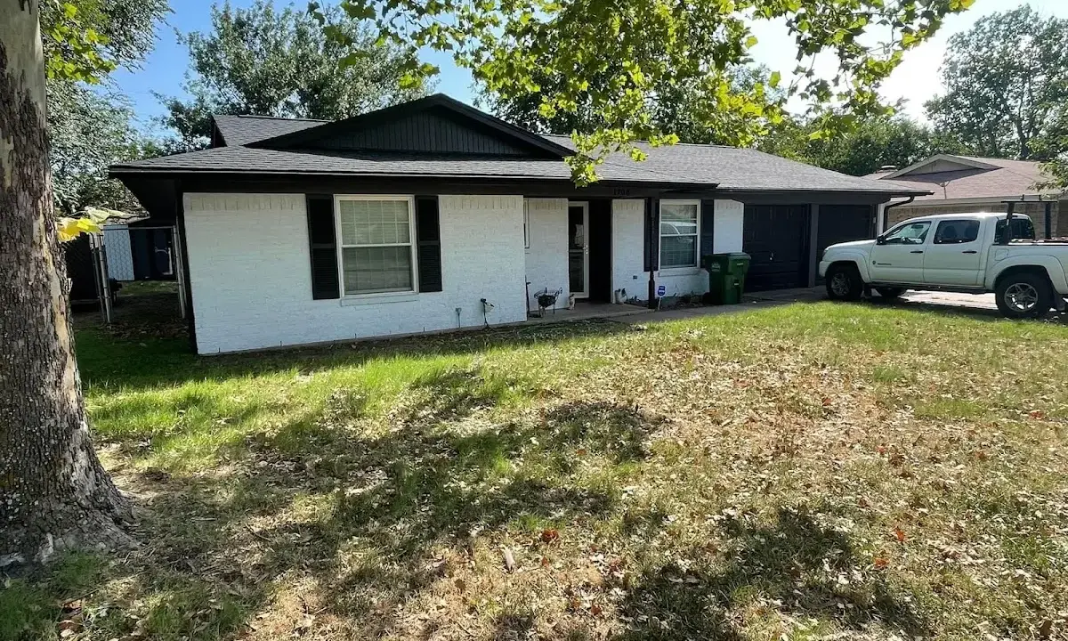 Professional roofing crew working on a residential roof in Redmond